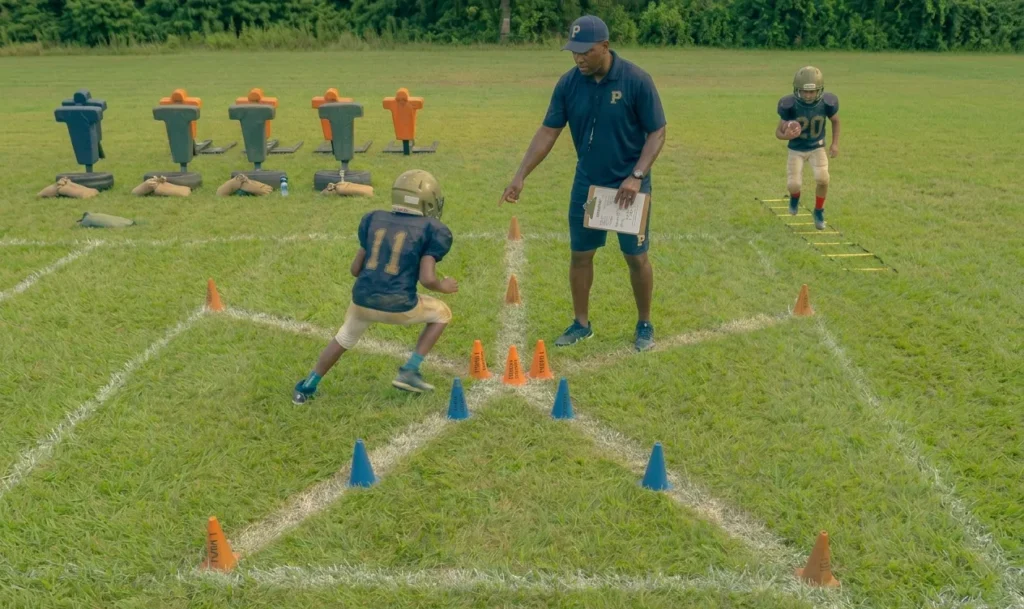 football footwork drills training with ladder and cone drills on field