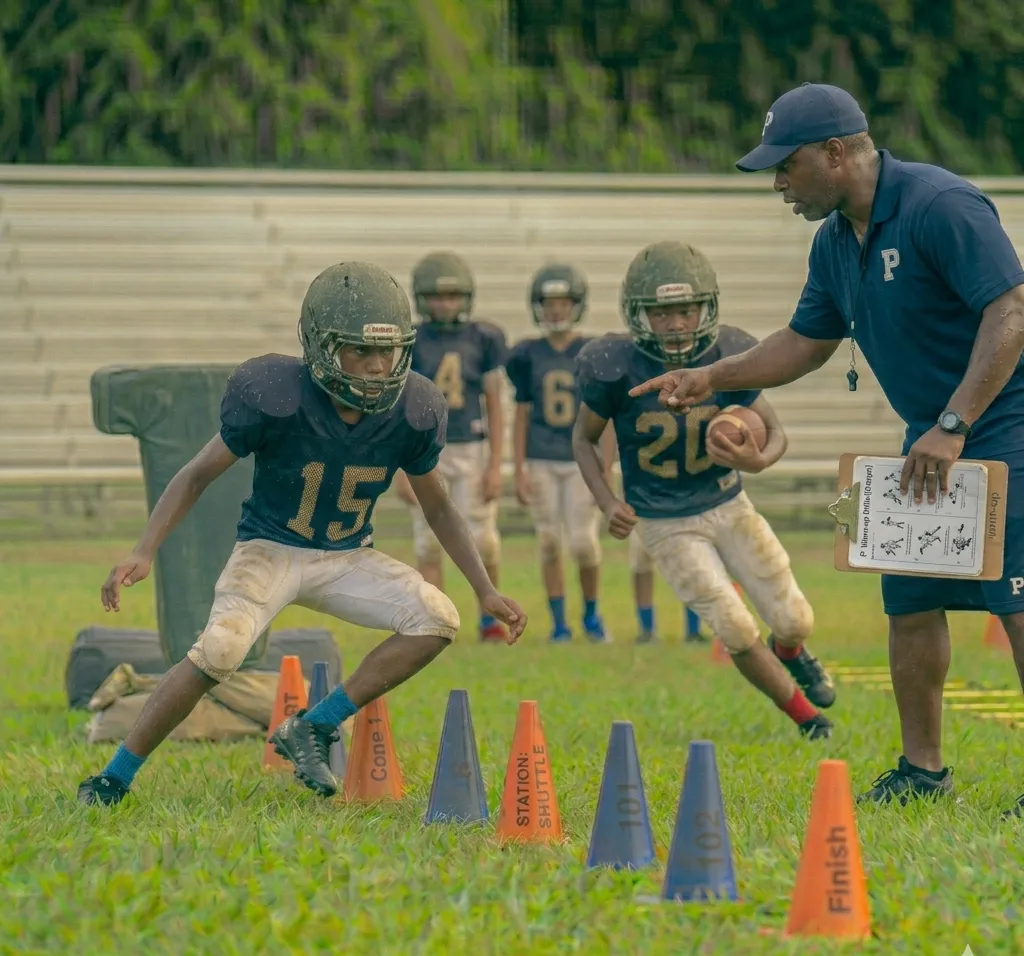 football player performing T drill with cone setup and lateral movement