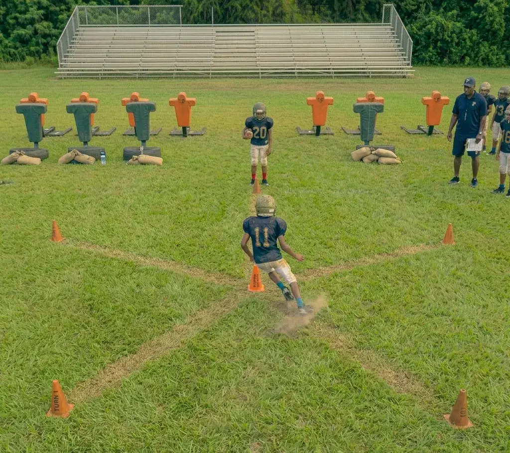 football player performing star pattern cone drill